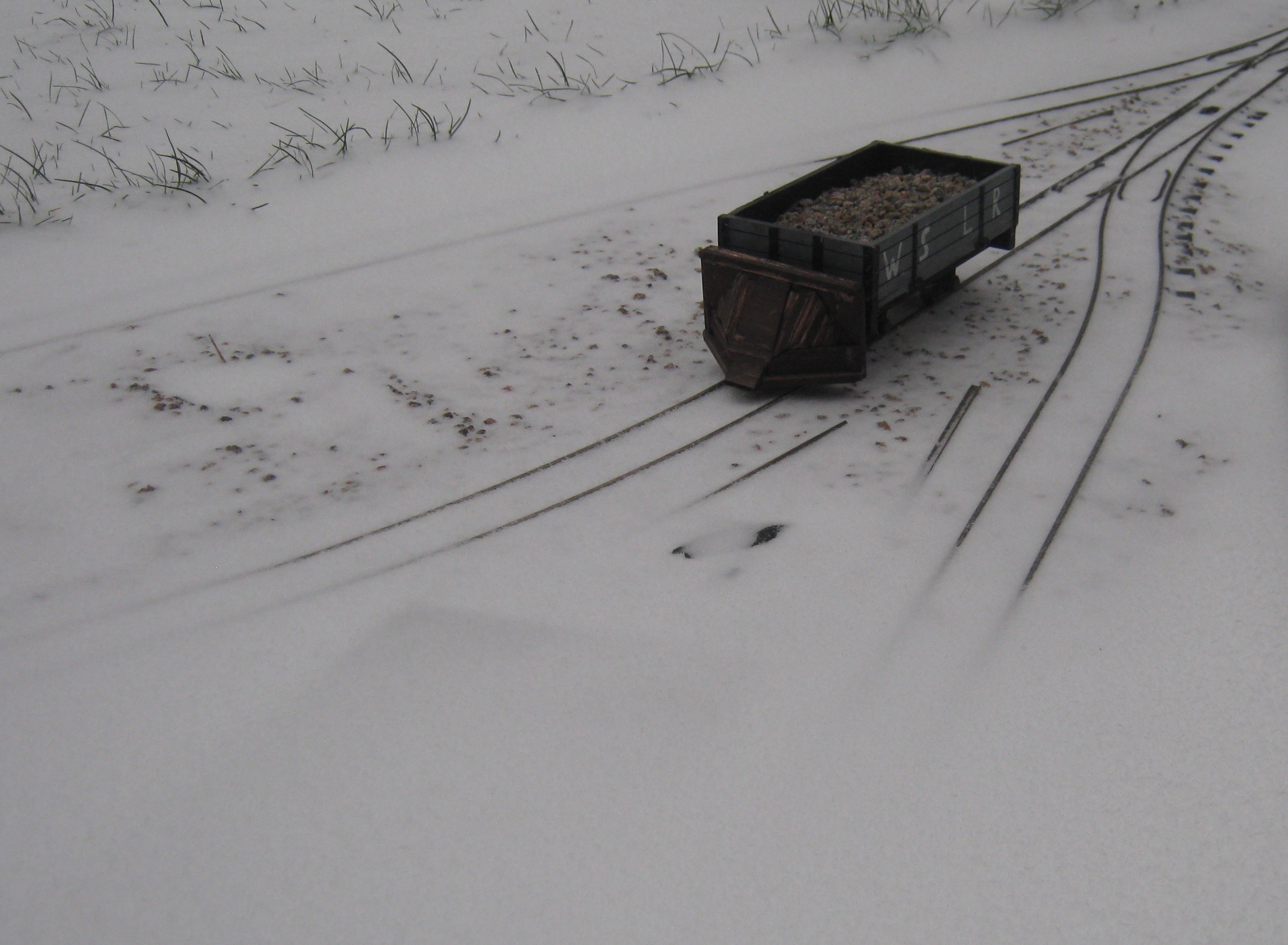 Scratchbuilt snowplough wagon awaits the snow clearing team.jpeg