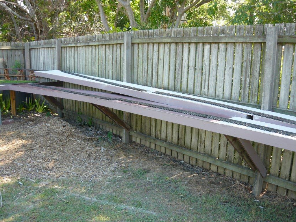 Baseboard down hill side fence.JPG